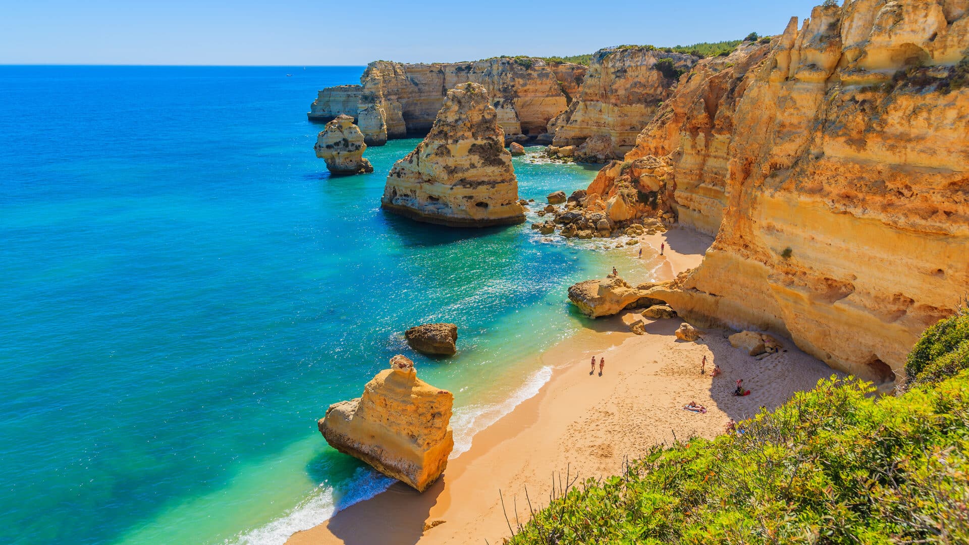 View of beautiful Marinha beach with crystal clear turquoise water near Carvoeiro town, Algarve region, Portugal